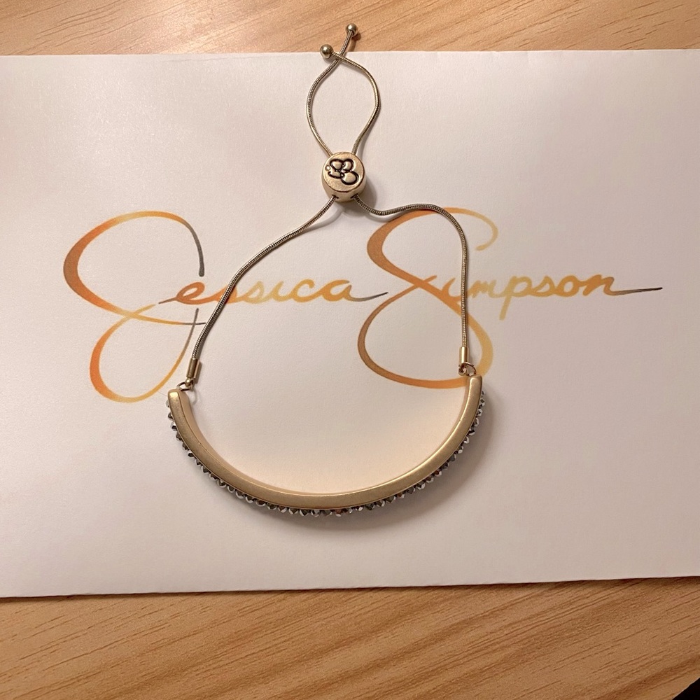 Jessica Simpson Gold Color with Diamond like effect. Adjustable